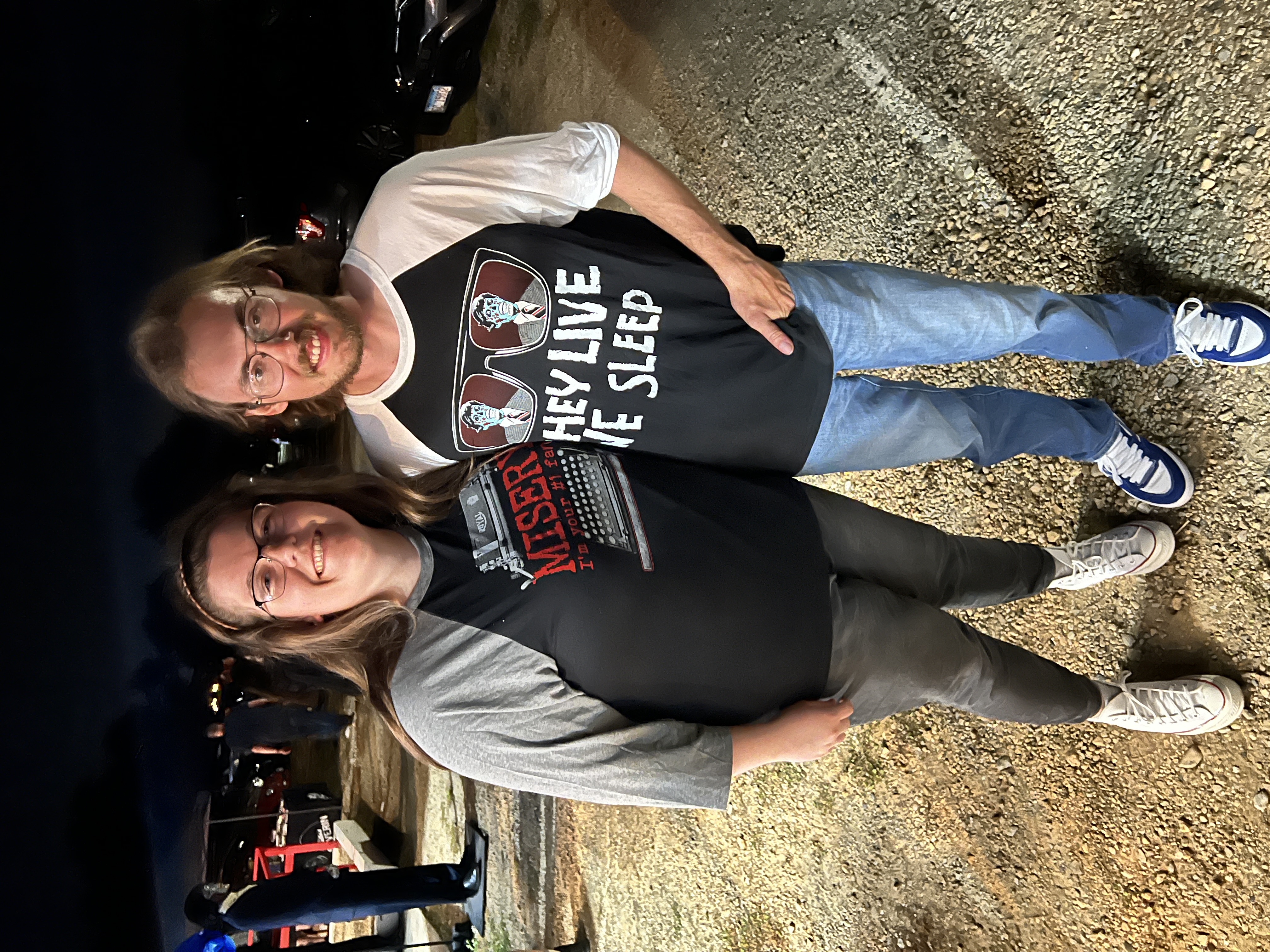 Couple wearing They Live and Misery LIX raglan shirts