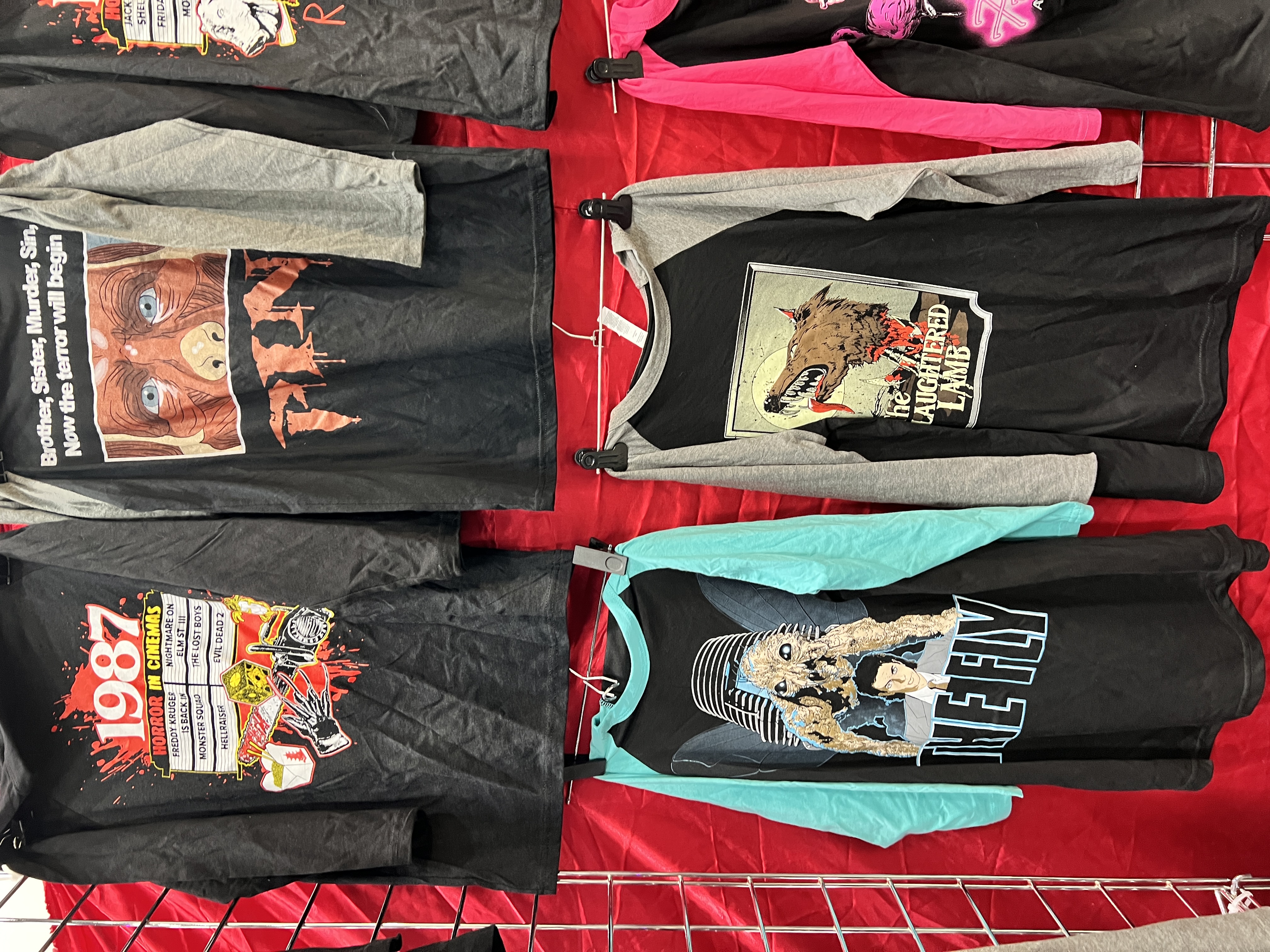 LIX convention booth — hats and t-shirts display