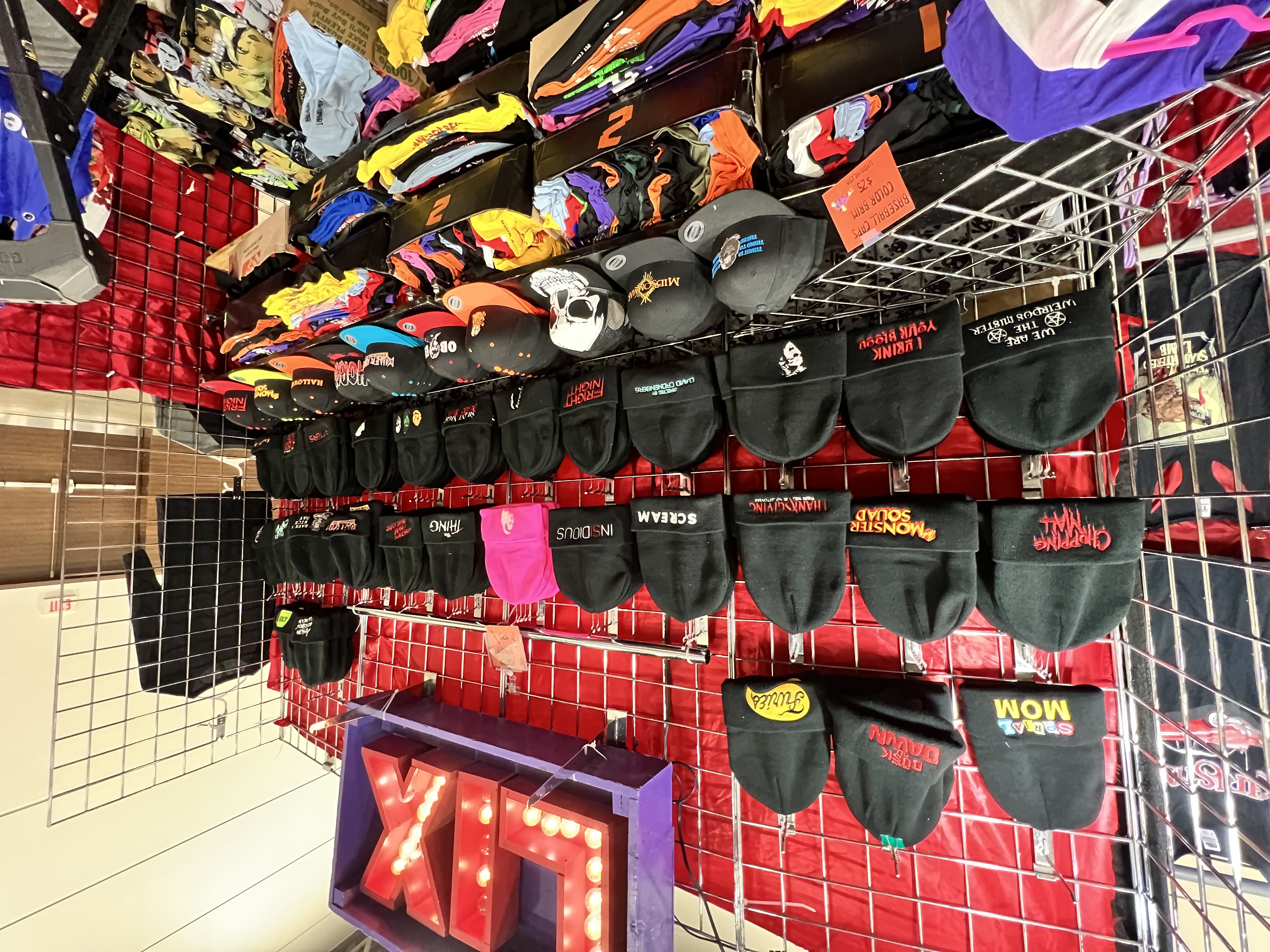LIX t-shirt table — colorful horror raglan display