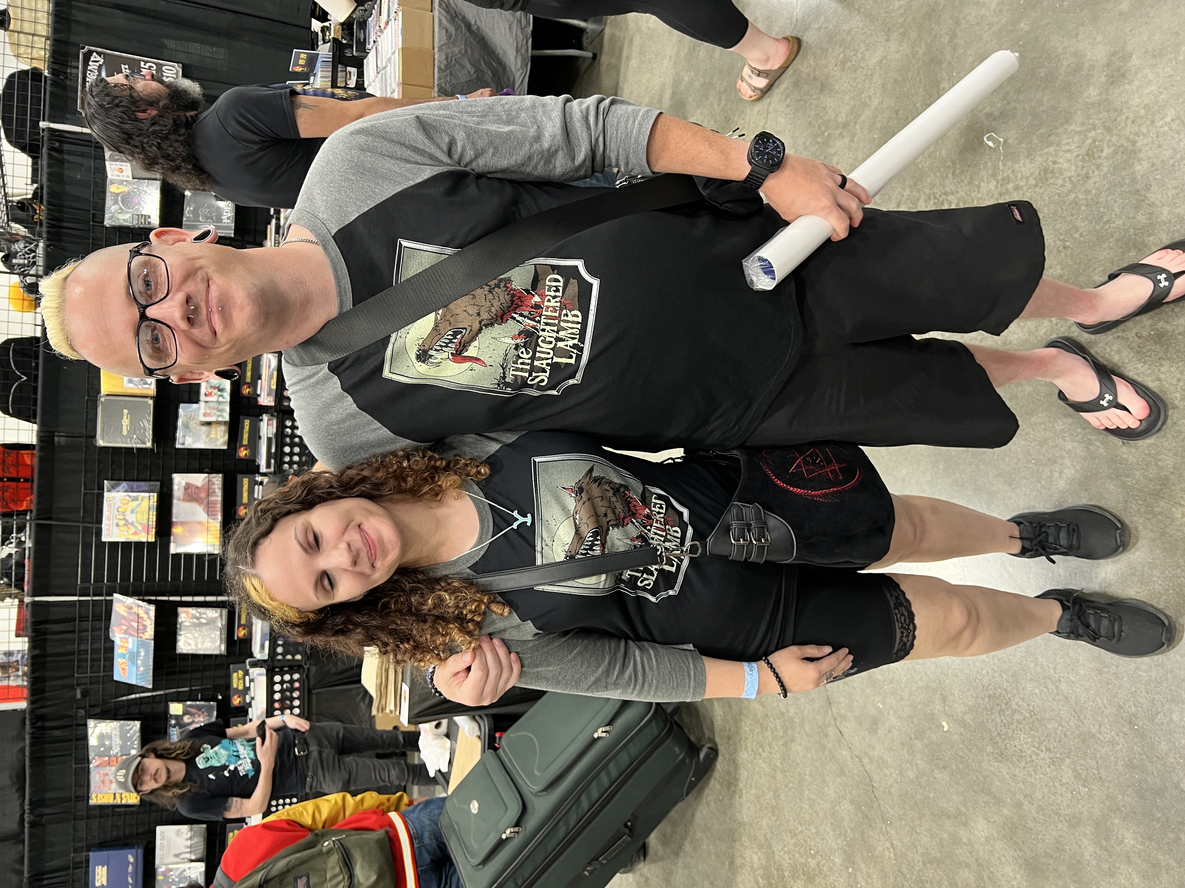 Fans wearing Slaughtered Lamb t-shirts at LIX booth